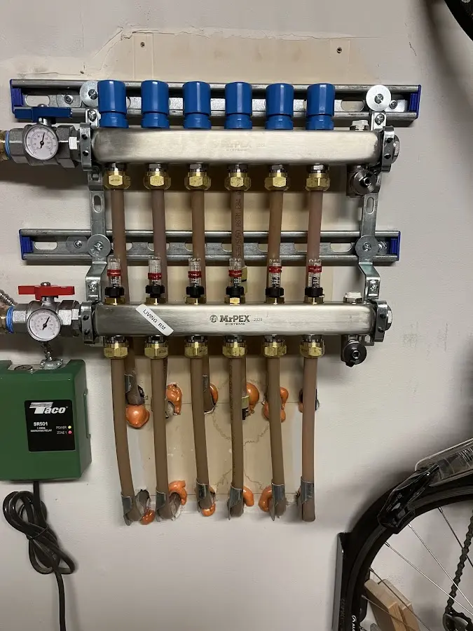 Plumber performing Water Heater Repair at a residential property in Lino Lakes